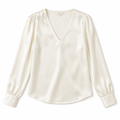Ivory silk blouse on white background