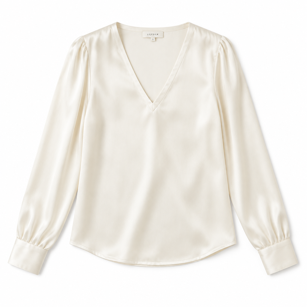 Ivory silk blouse on white background