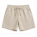 Beige linen shorts on white background